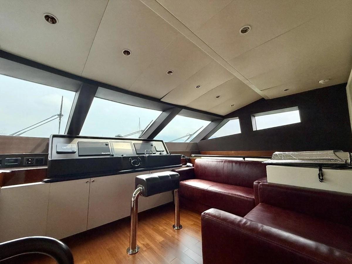 The helm features a modern control panel and comfortable seating with panoramic windows. aboard HEYSEA ASTERIA 126/1 Yacht for Sale