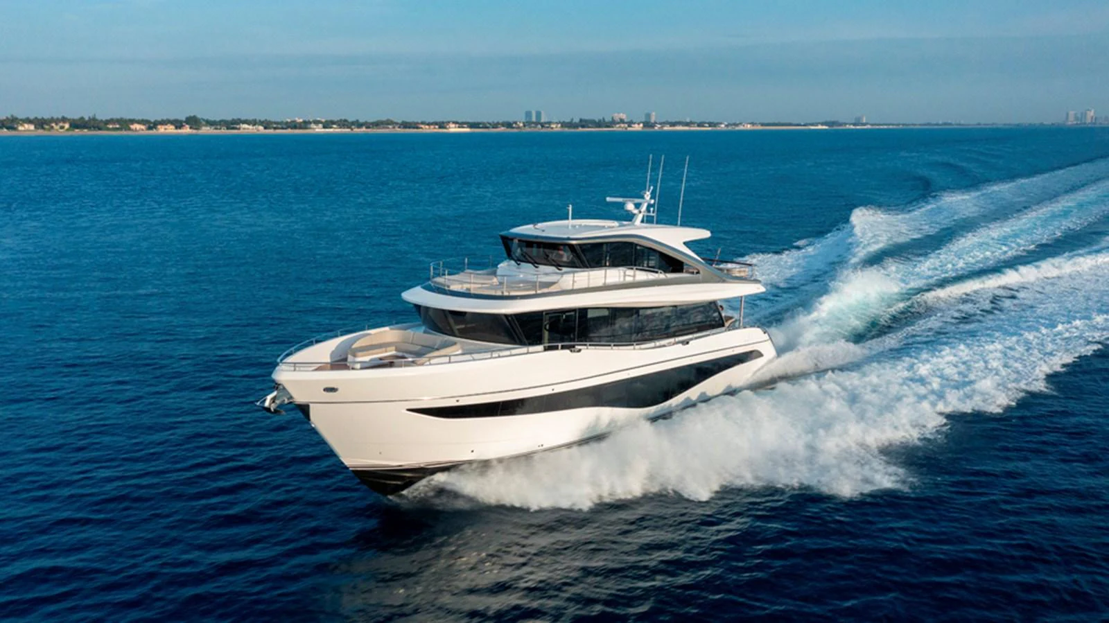 A sleek and modern yacht cruises swiftly on the open water, showcasing its elegant design and powerful performance. aboard PRINCESS X80 Yacht for Sale
