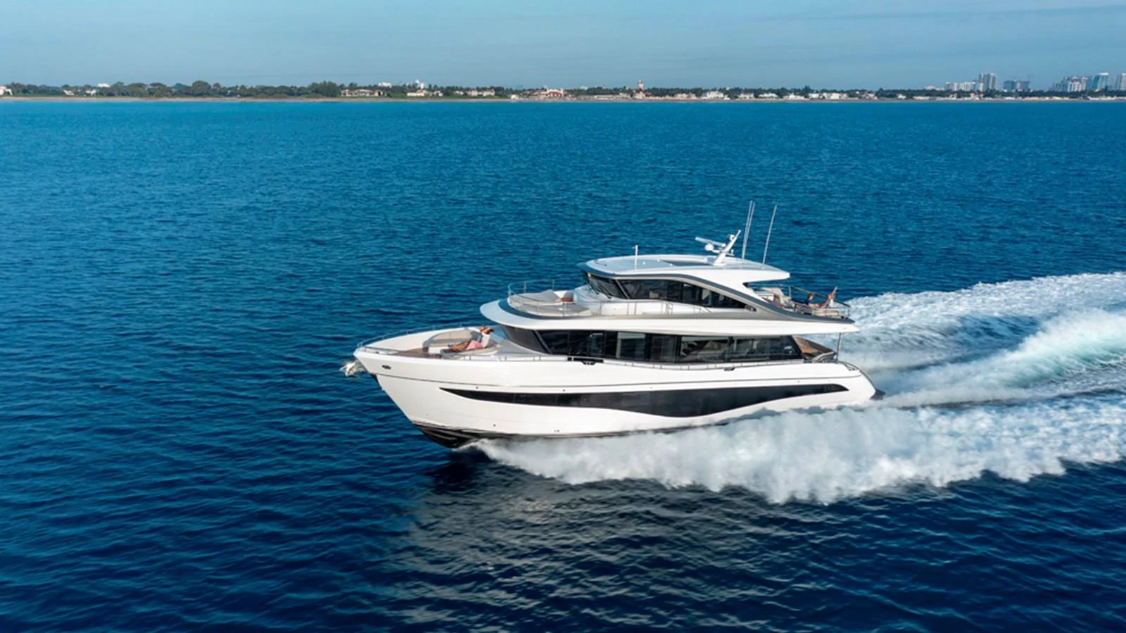 A sleek and modern yacht cruises swiftly across the open water, showcasing its elegant design and powerful performance. aboard PRINCESS X80 Yacht for Sale