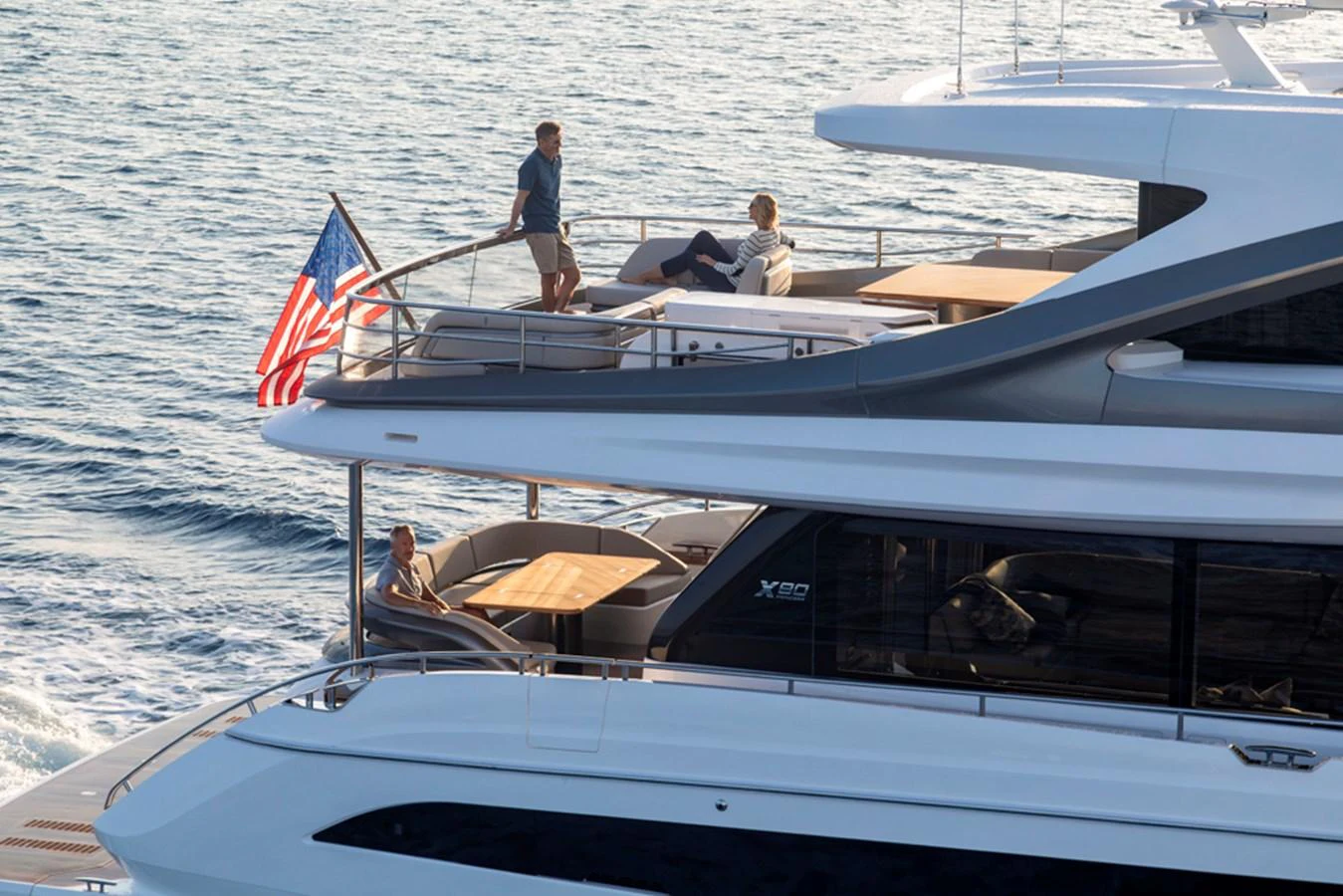 The yacht's aft deck features multiple levels with lounging areas, perfect for relaxation and socializing. aboard PRINCESS X80 Yacht for Sale