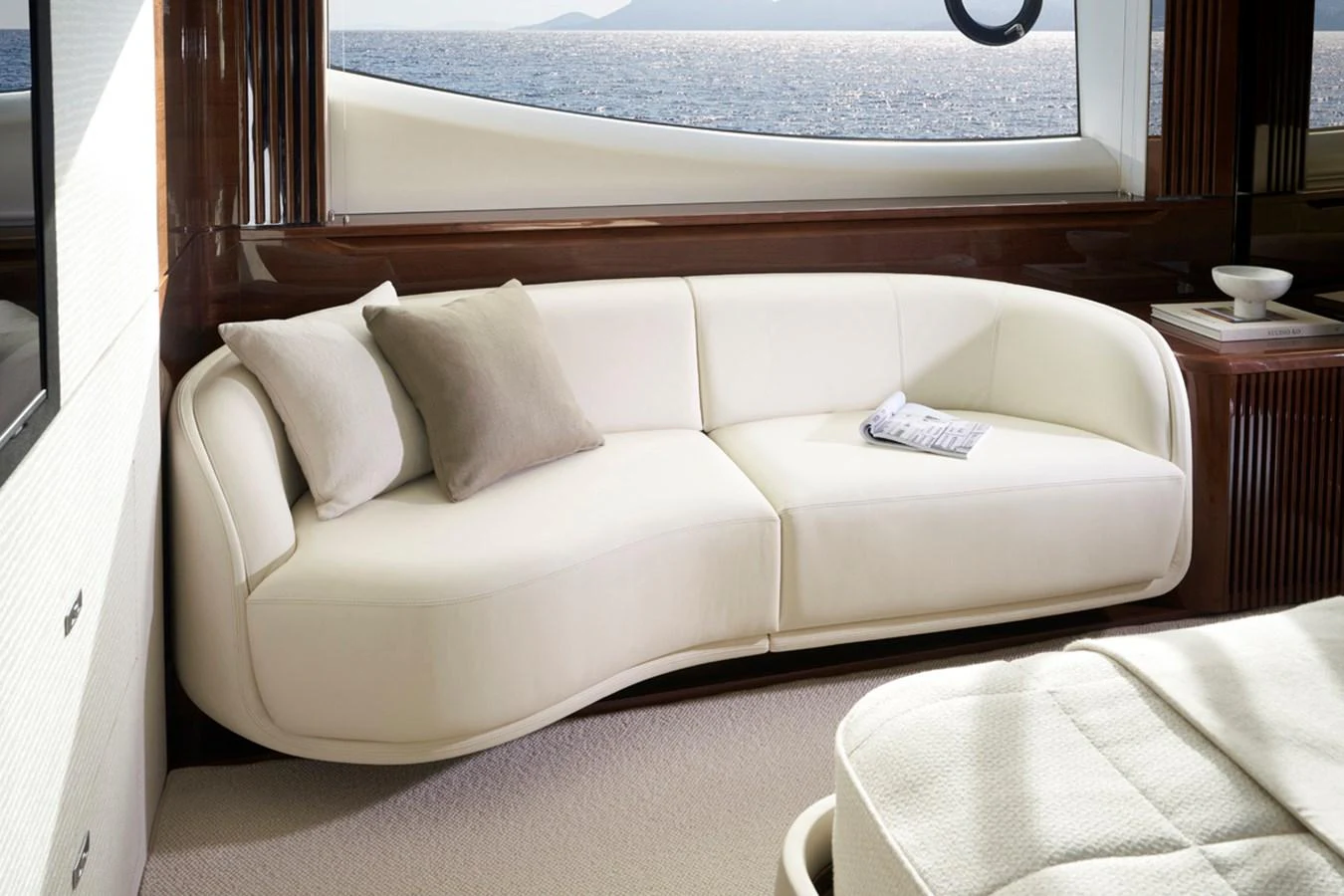 The yacht's interior features a stylish and comfortable seating area with a view of the sea. aboard PRINCESS X80 Yacht for Sale