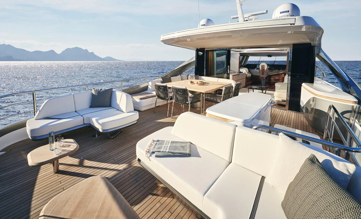 The spacious aft deck offers luxurious seating and dining areas with stunning ocean views. aboard PRINCESS X80 Yacht for Sale