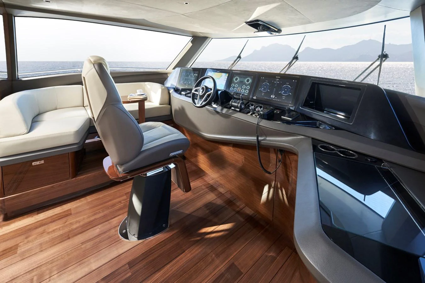 The helm station features a sleek design with modern navigation equipment and luxurious seating. aboard PRINCESS X80 Yacht for Sale