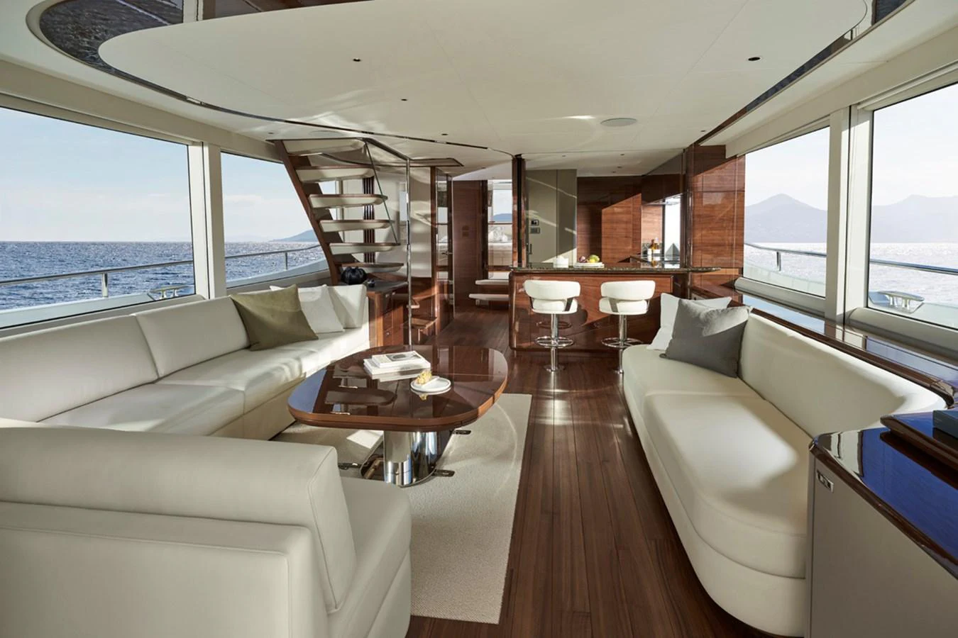 The spacious salon features elegant furnishings and panoramic views. aboard PRINCESS X80 Yacht for Sale