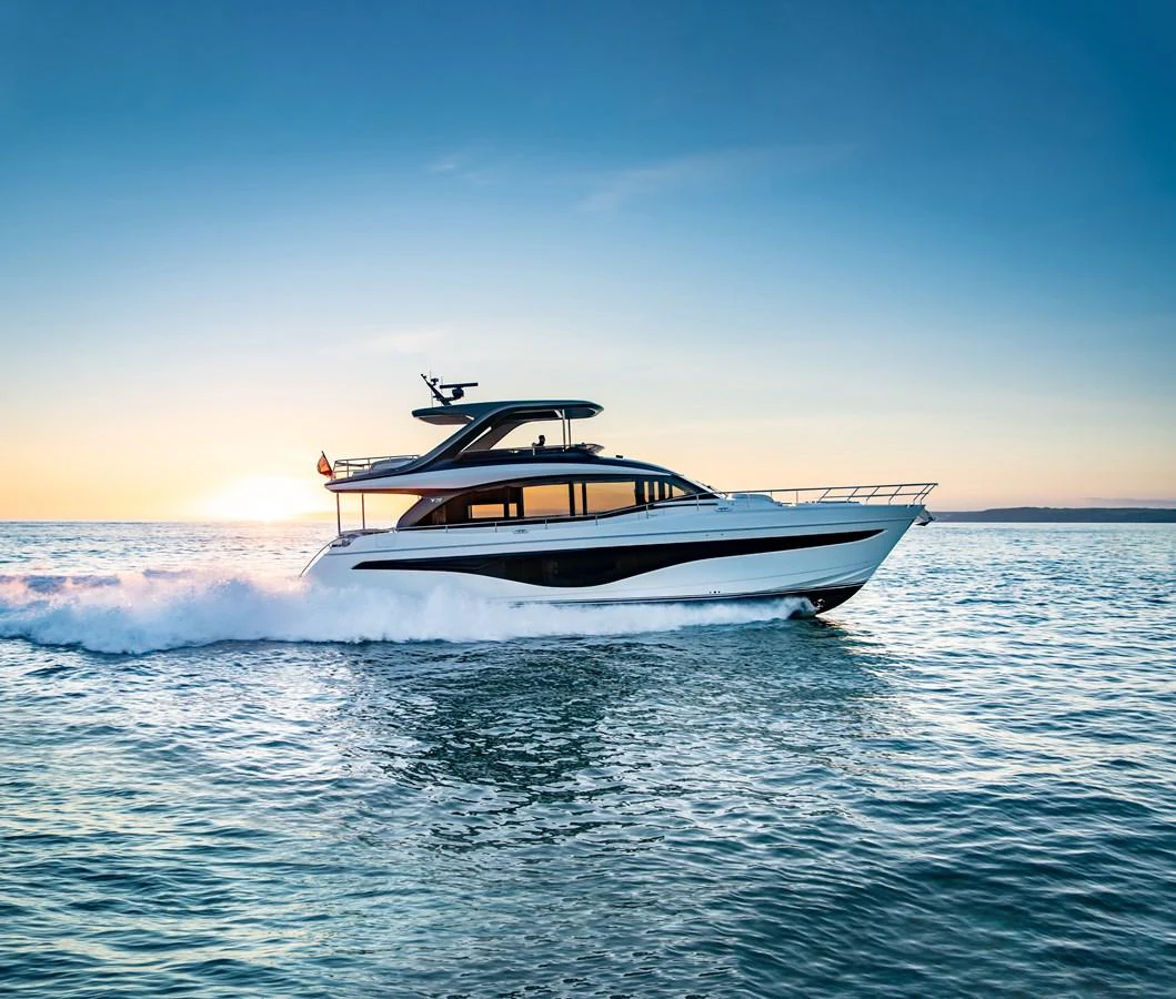 A sleek yacht cruises gracefully on the open water at sunset. aboard PRINCESS Y72 Yacht for Sale