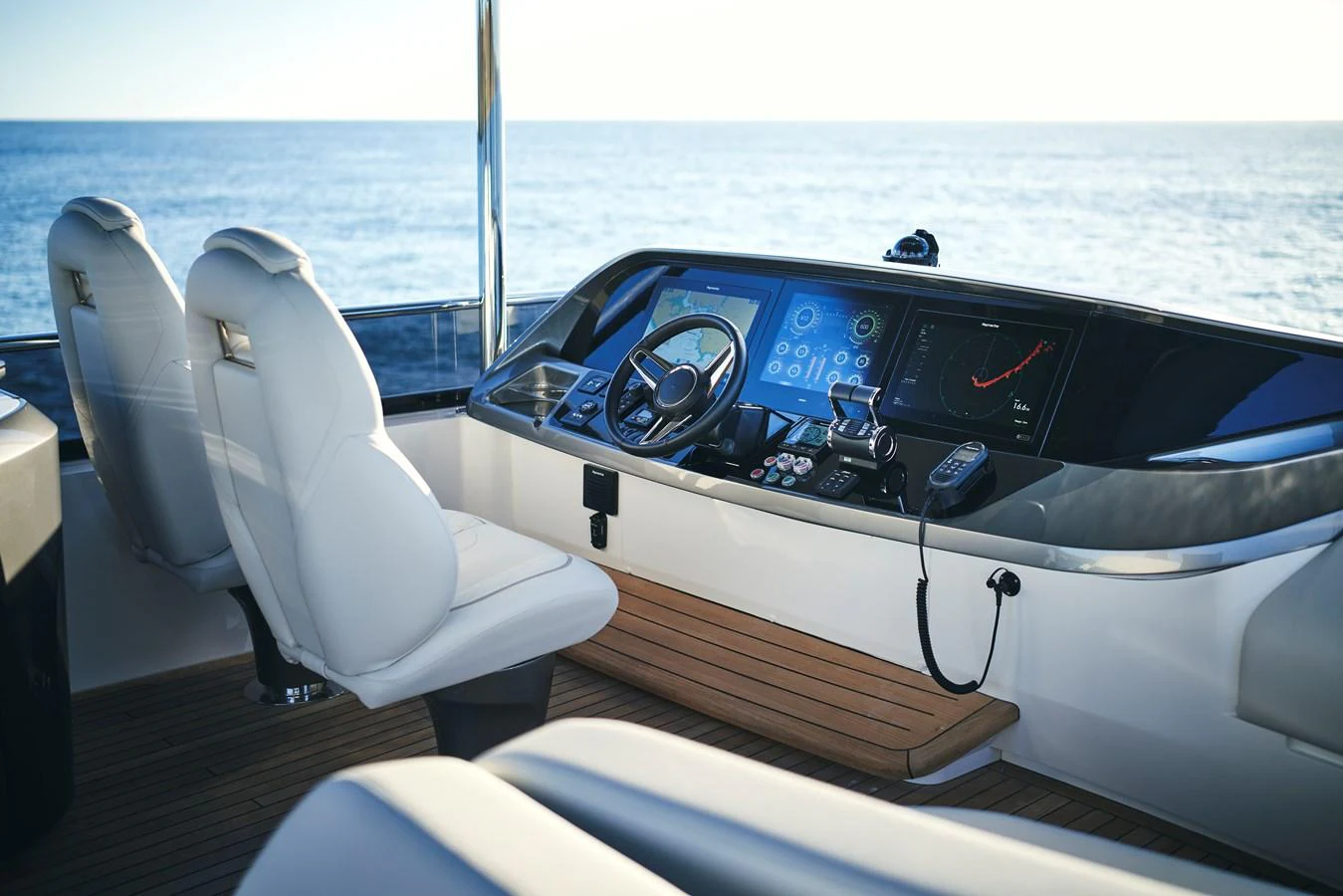 The helm station offers a sleek and modern design with state-of-the-art navigation equipment. aboard PRINCESS Y72 Yacht for Sale