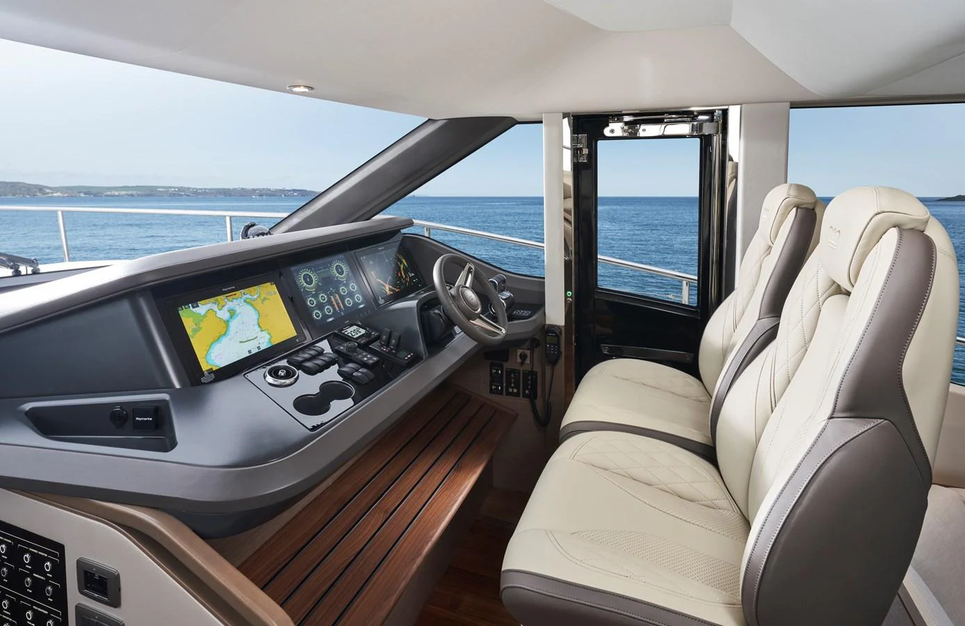 The helm station features state-of-the-art navigation equipment and luxurious seating with a panoramic view of the sea. aboard PRINCESS Y72 Yacht for Sale