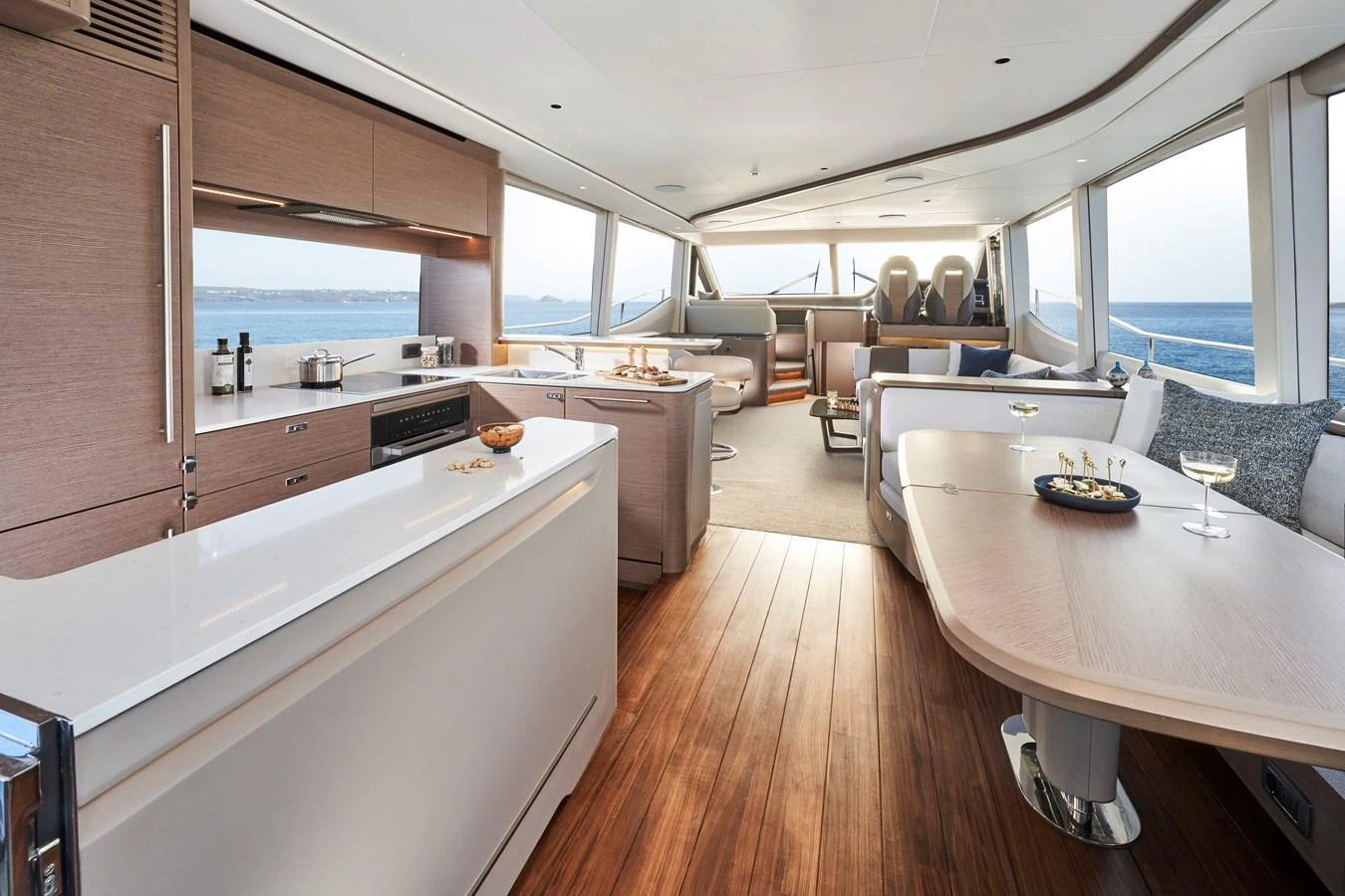 The yacht's salon features a spacious and modern design with ample seating and a well-equipped galley. aboard PRINCESS Y72 Yacht for Sale