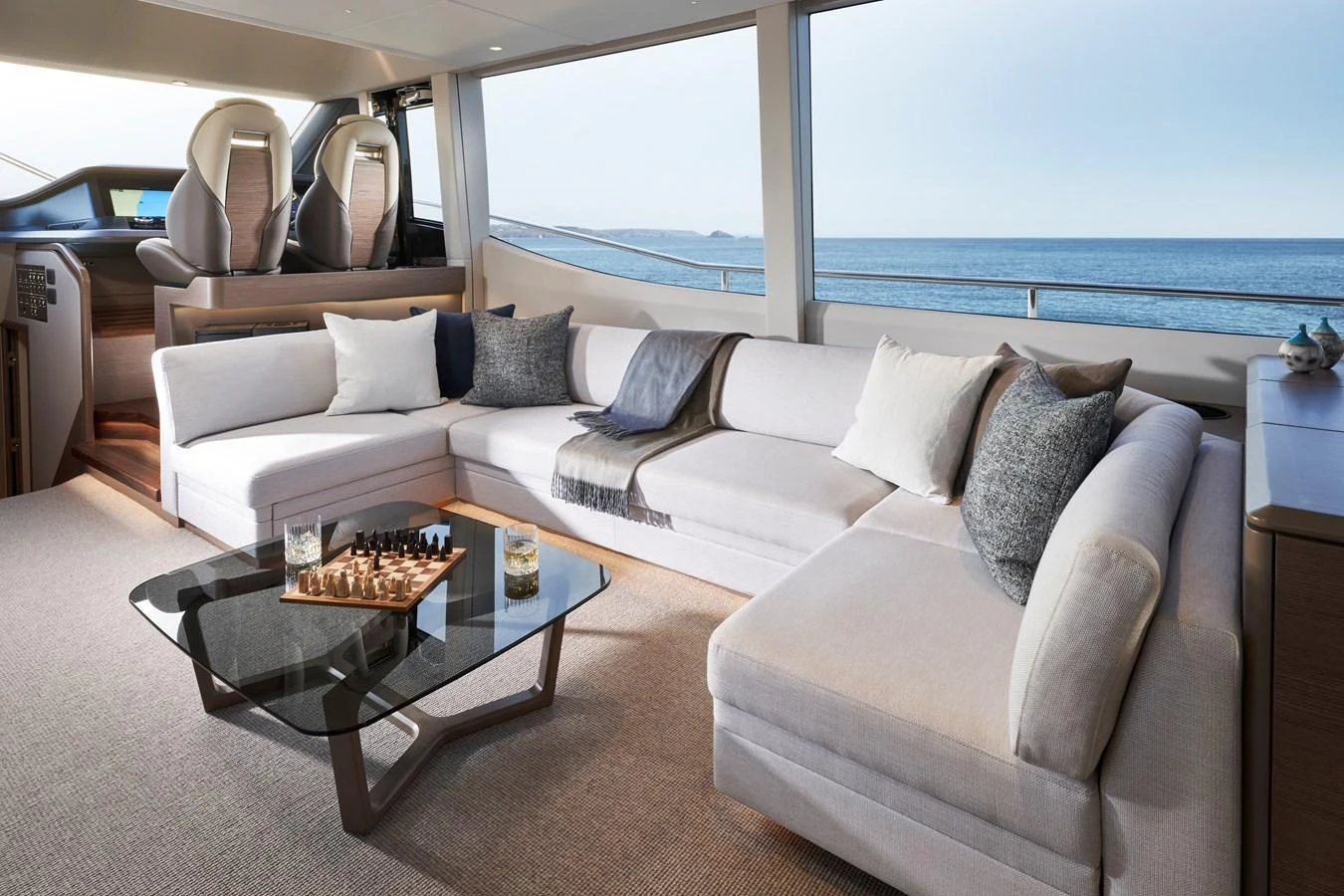 The salon offers a spacious and comfortable seating area with panoramic ocean views. aboard PRINCESS Y72 Yacht for Sale