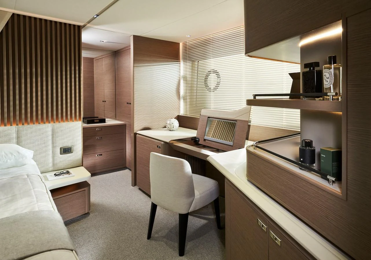 A luxurious stateroom featuring elegant wooden finishes and modern amenities. aboard PRINCESS Y72 Yacht for Sale