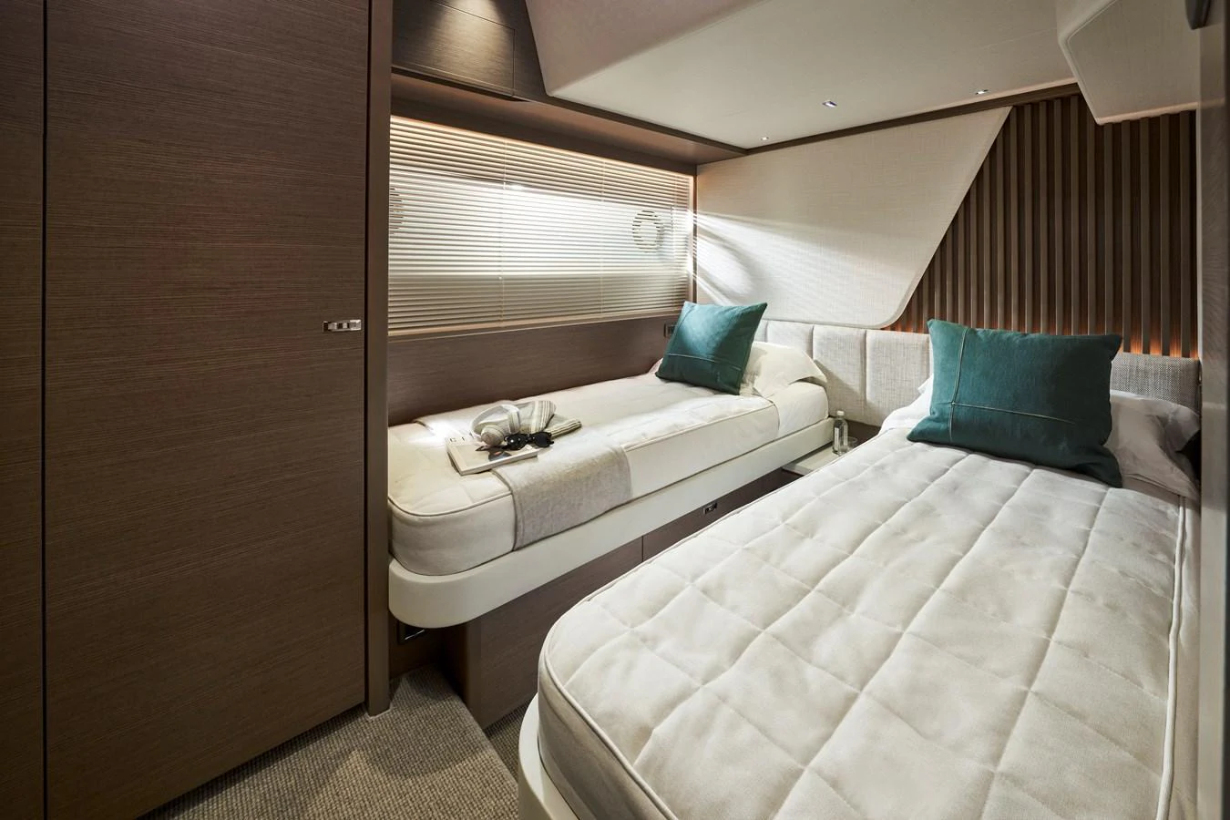 The guest stateroom features twin beds with elegant bedding and modern decor. aboard PRINCESS Y72 Yacht for Sale