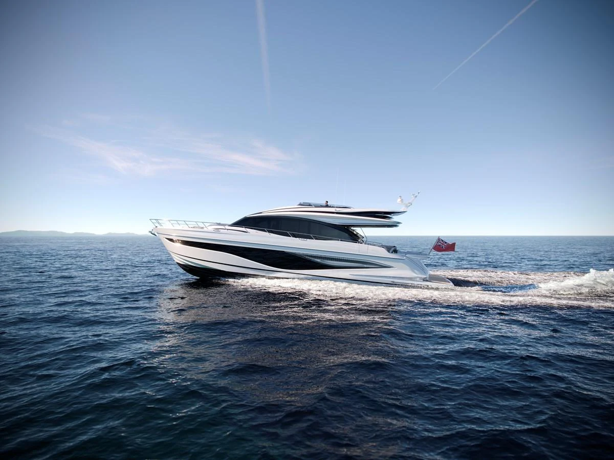 A sleek and modern yacht glides effortlessly across the open sea under a clear sky. aboard PRINCESS S74 Yacht for Sale