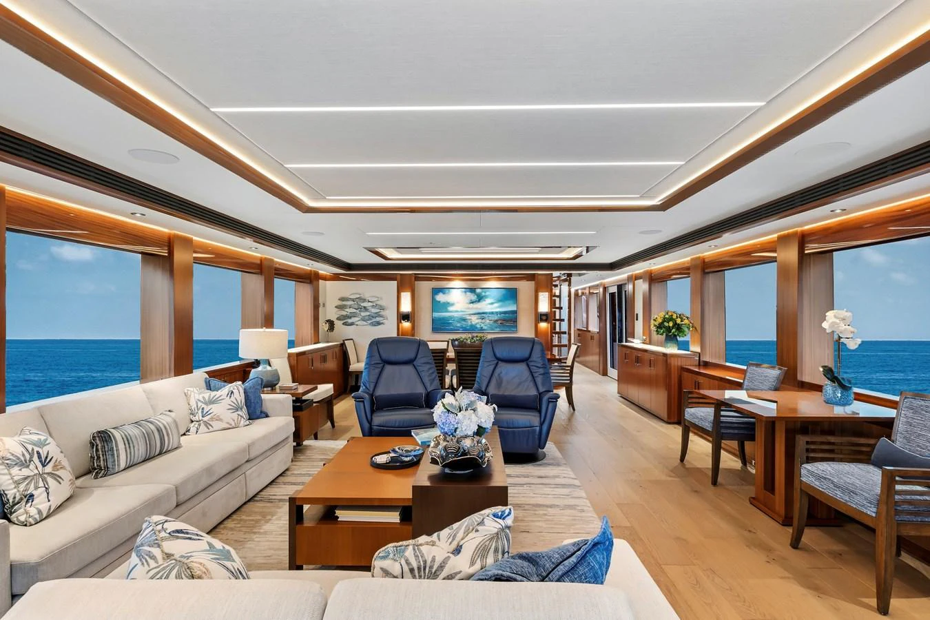 The spacious salon features elegant seating with panoramic ocean views. aboard SEAS THE DAY Yacht for Sale