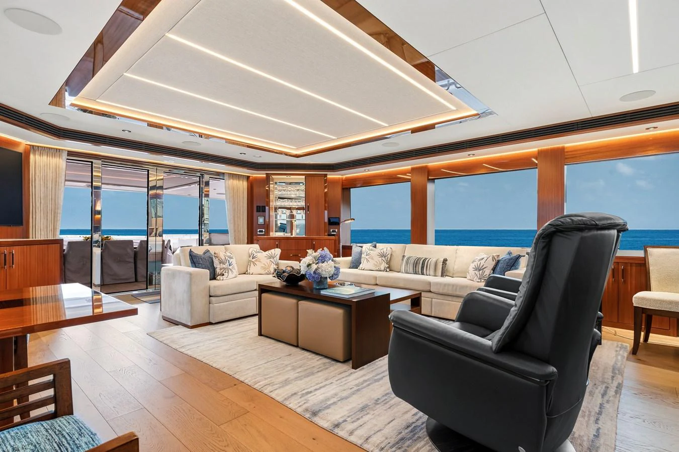 The salon offers a spacious and luxurious seating area with panoramic ocean views. aboard SEAS THE DAY Yacht for Sale