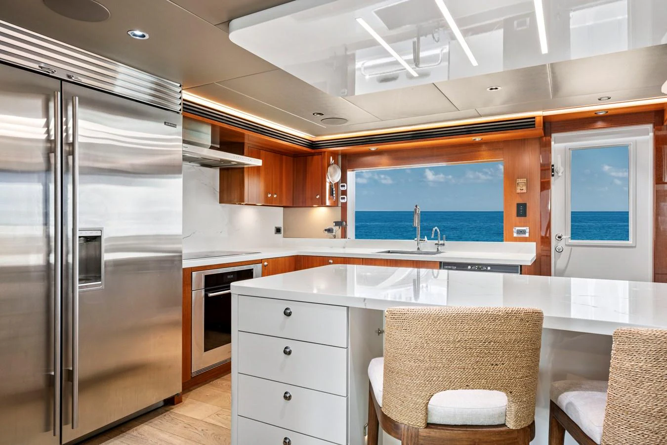 The yacht's galley features modern appliances, sleek cabinetry, and a stunning ocean view. aboard SEAS THE DAY Yacht for Sale