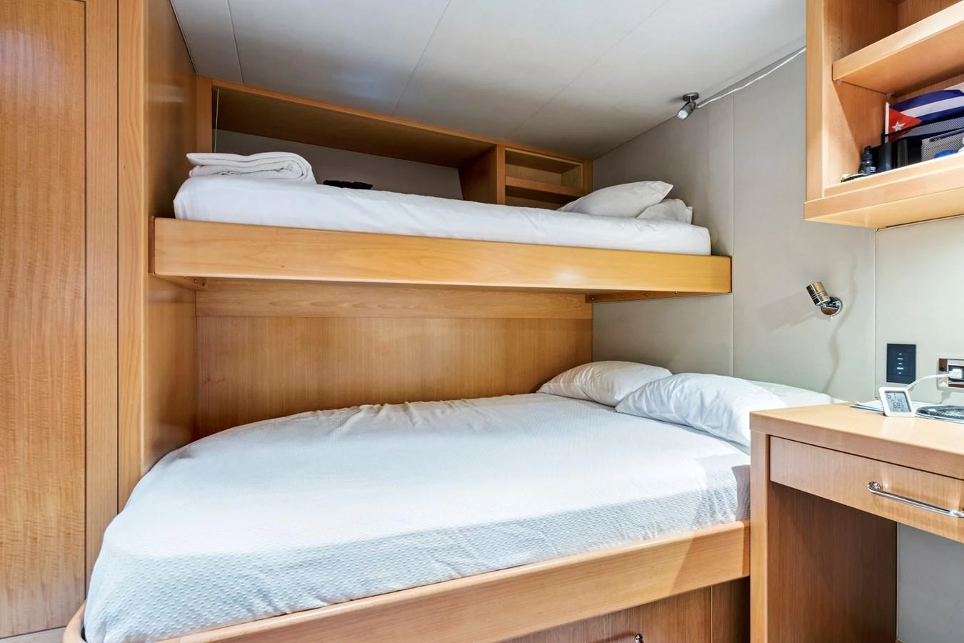 The crew cabin features practical bunk beds and a compact workspace, ensuring comfort and functionality. aboard SEAS THE DAY Yacht for Sale