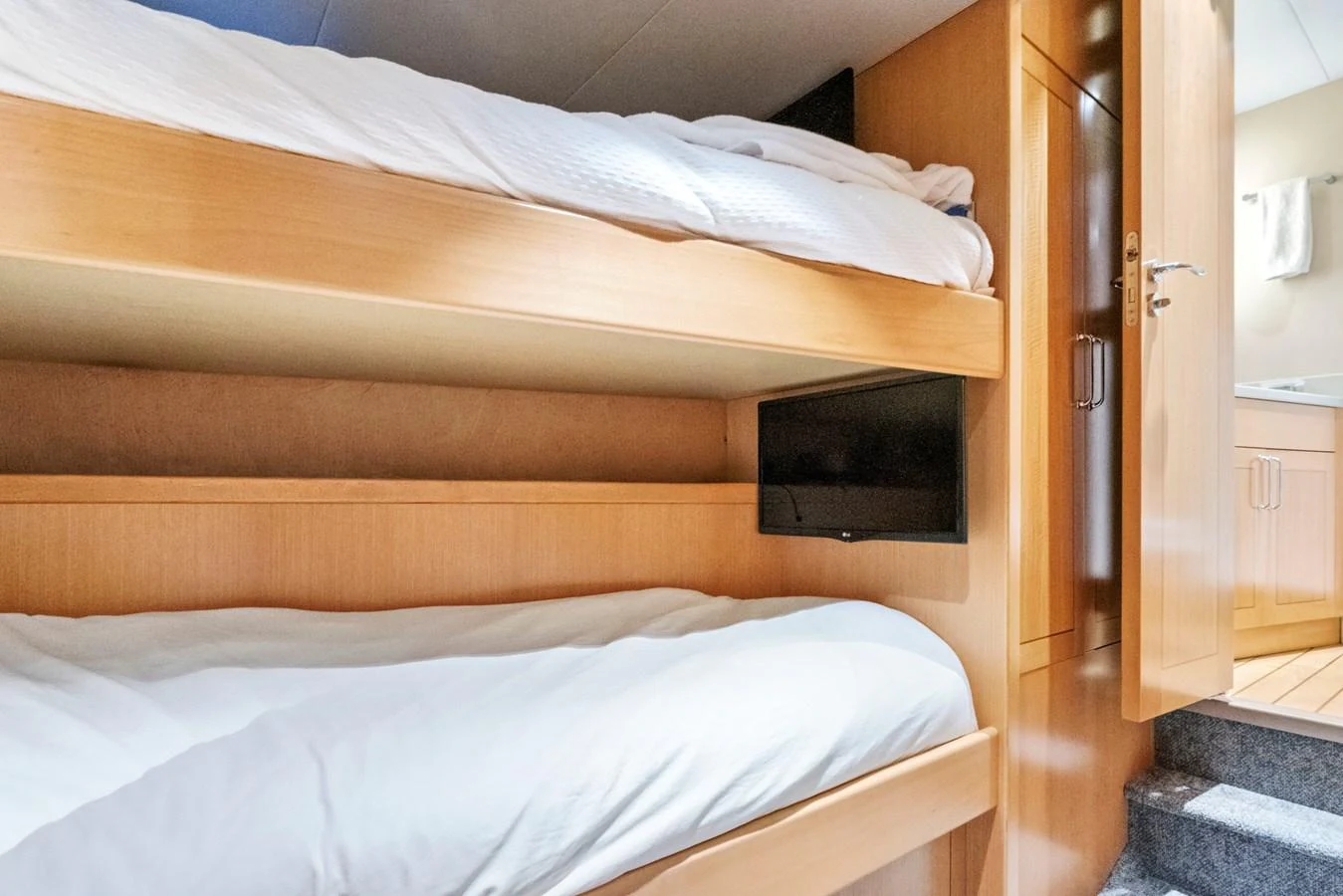 The crew quarters feature cozy bunk beds and a compact, functional design. aboard SEAS THE DAY Yacht for Sale
