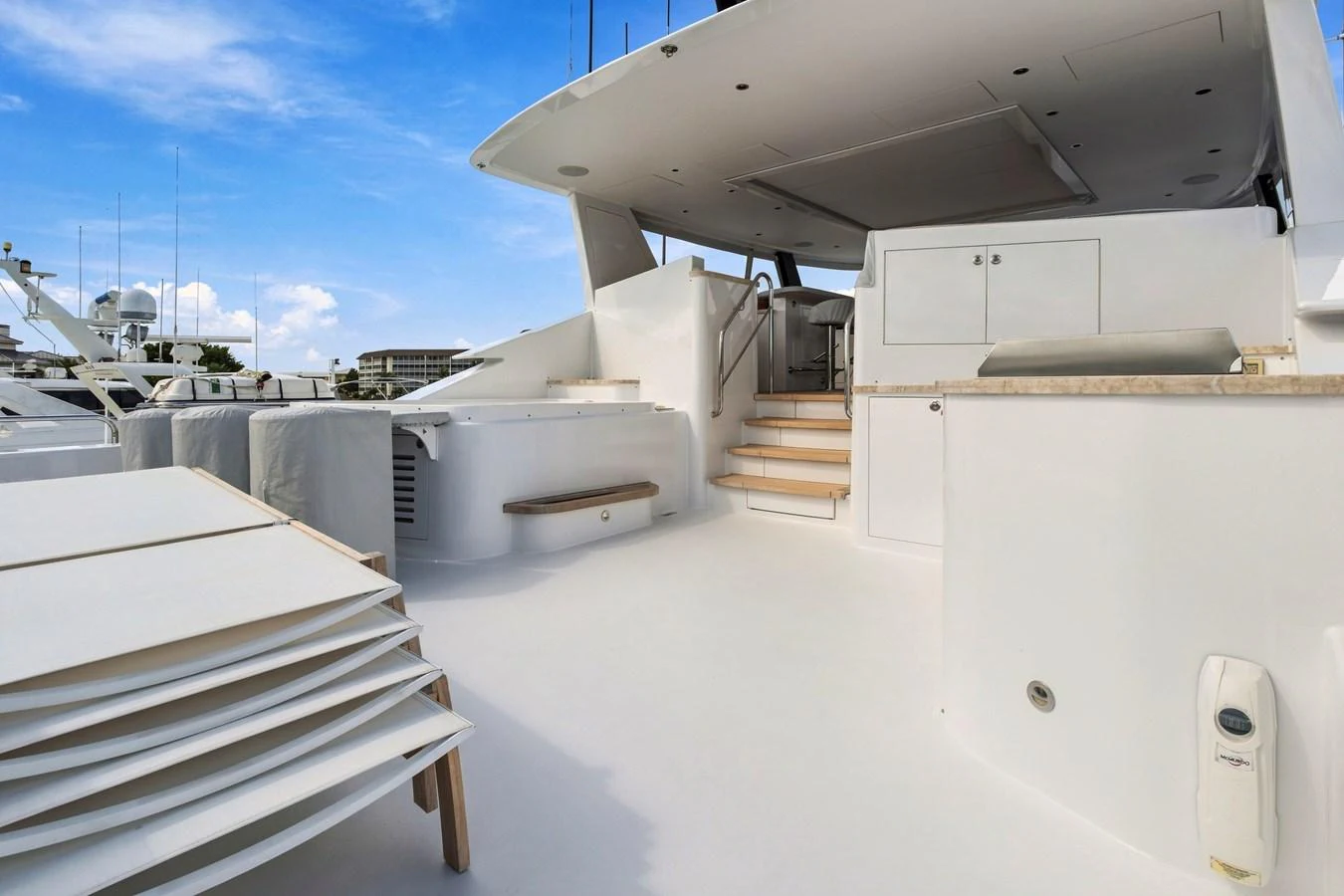 The spacious aft deck offers a clean and modern outdoor area for relaxation and entertainment. aboard SEAS THE DAY Yacht for Sale