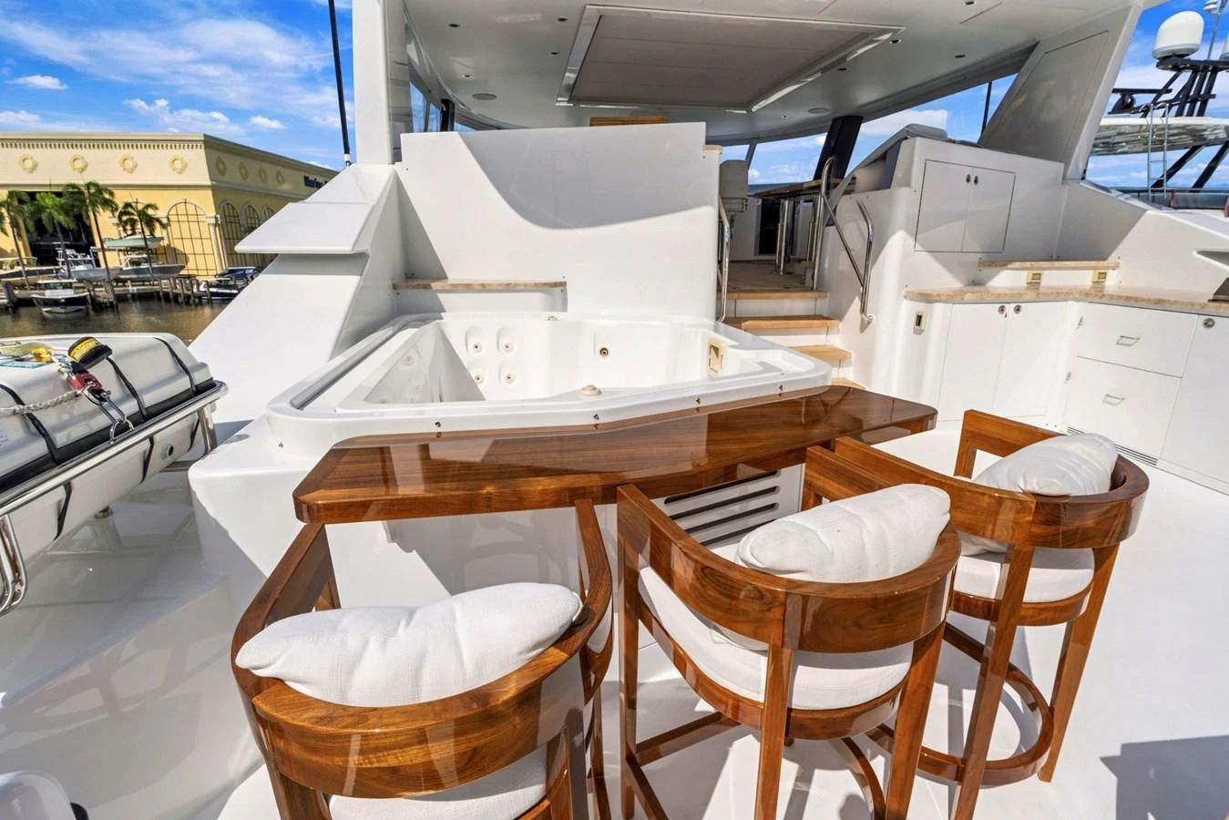 The sundeck features a luxurious jacuzzi and a stylish bar area with comfortable seating. aboard SEAS THE DAY Yacht for Sale