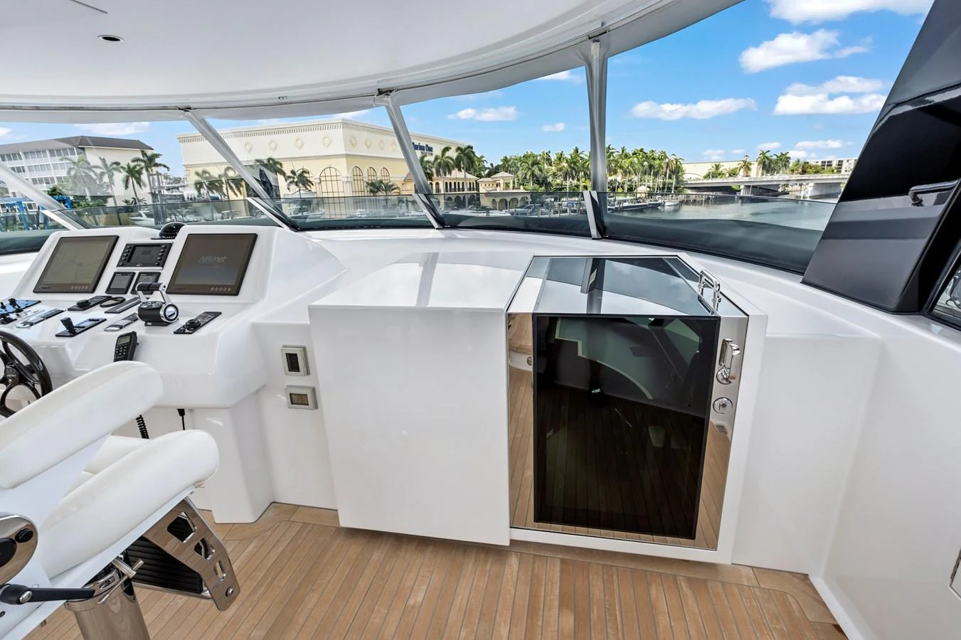 The helm station offers a sleek and modern design with advanced navigation equipment and panoramic views. aboard SEAS THE DAY Yacht for Sale