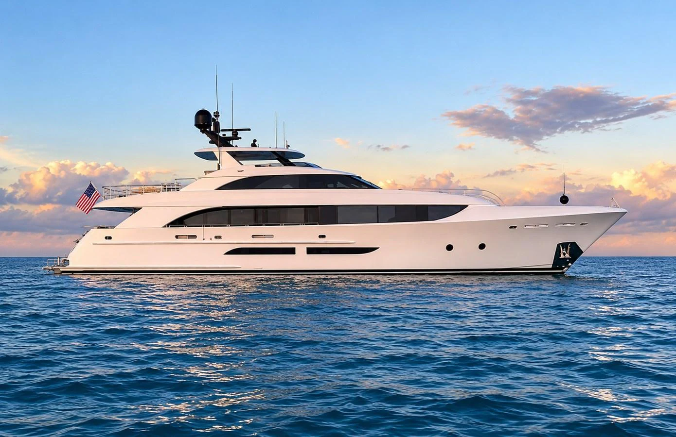 A sleek and modern yacht glides gracefully on calm waters under a picturesque sky. aboard SEAS THE DAY Yacht for Sale
