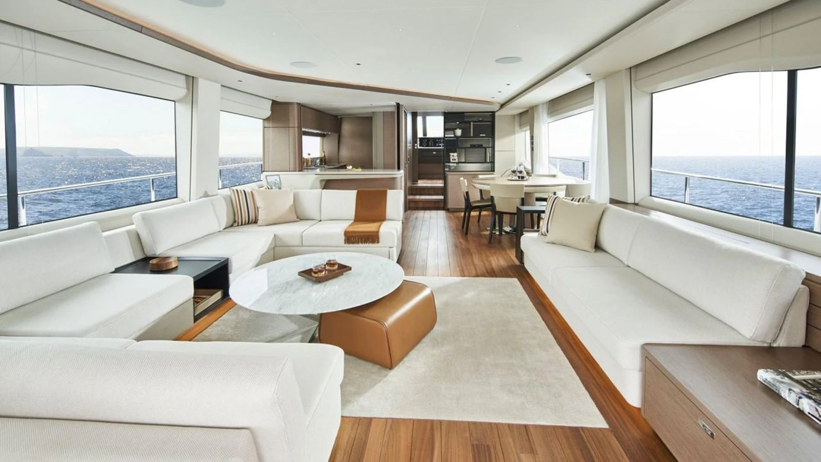 The spacious salon features elegant furnishings and panoramic windows offering stunning sea views. aboard PRINCESS Y88 Yacht for Sale