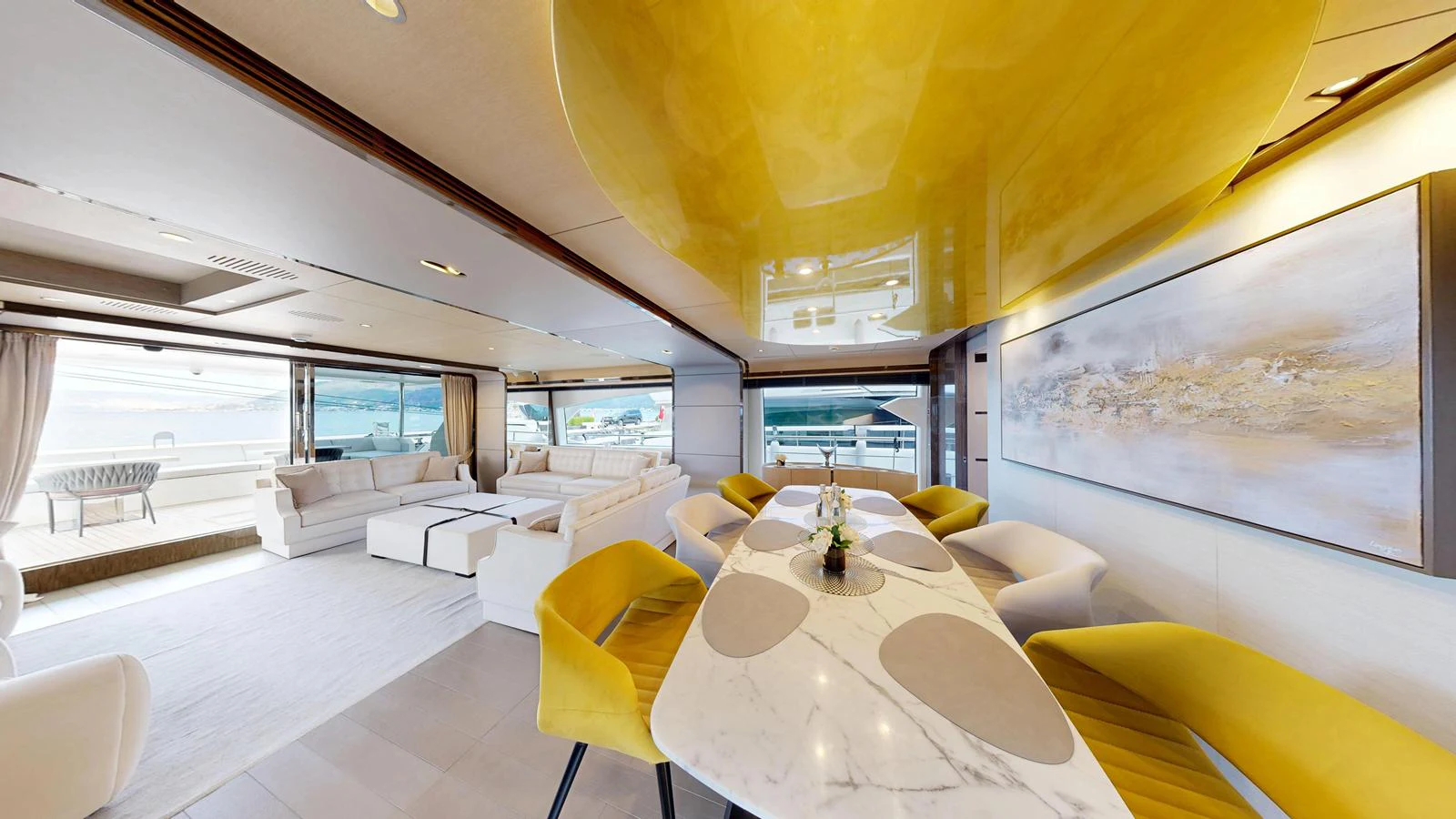The spacious salon features modern furnishings with a blend of white and yellow accents, offering a luxurious and inviting atmosphere. aboard 98.92' AZIMUT GRANDE Yacht for Sale
