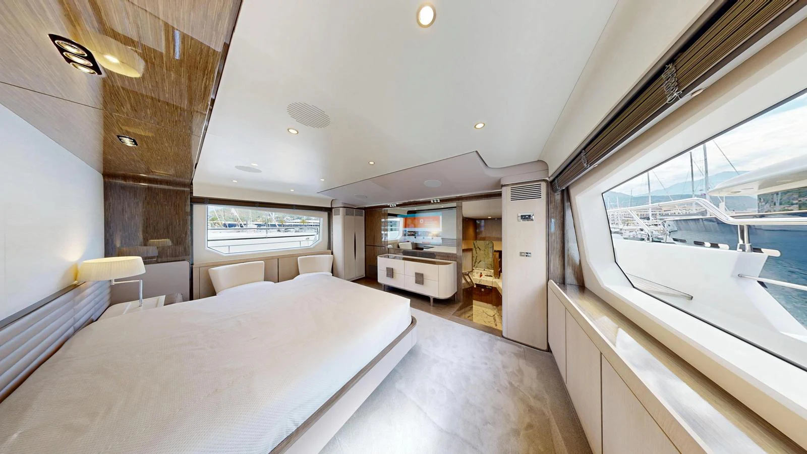 The master stateroom offers a spacious and luxurious retreat with large windows providing stunning views. aboard 98.92' AZIMUT GRANDE Yacht for Sale
