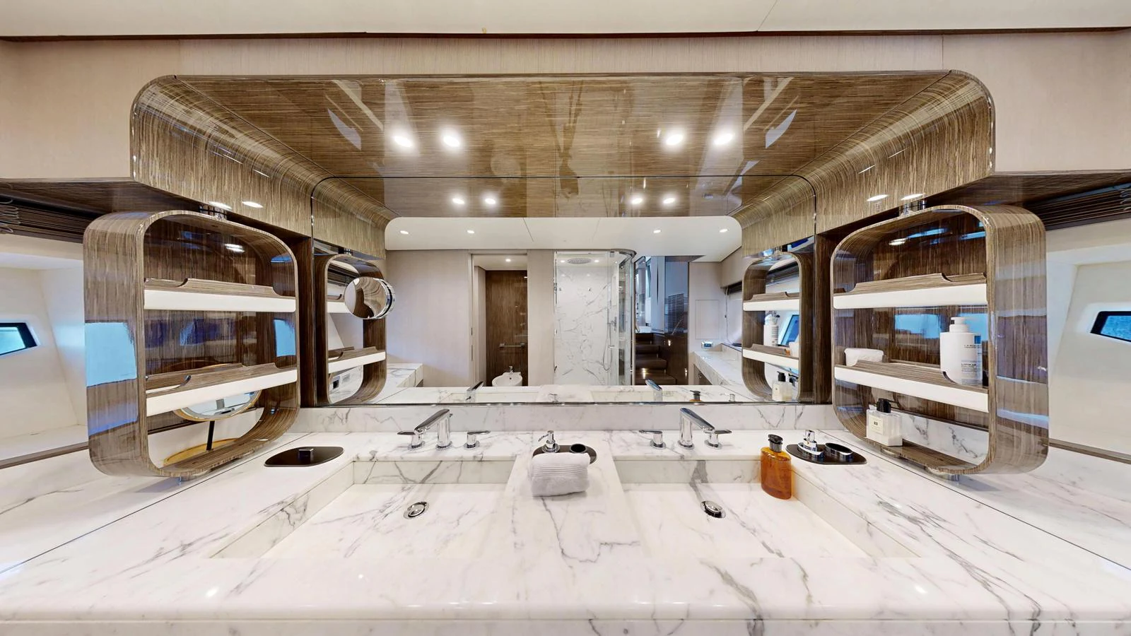 The yacht's bathroom features a luxurious marble countertop with dual sinks and modern fixtures. aboard 98.92' AZIMUT GRANDE Yacht for Sale