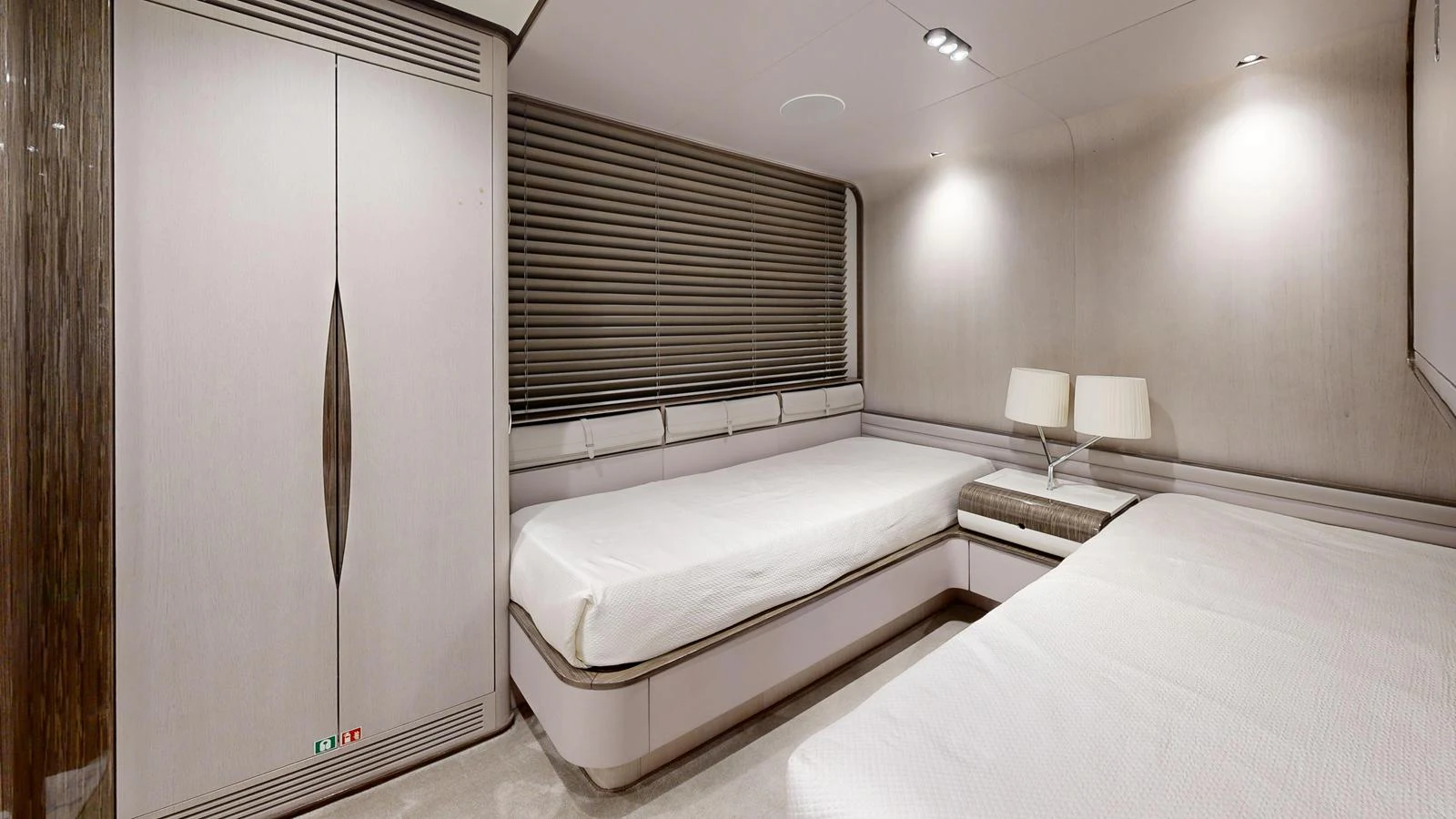 The guest stateroom features two single beds with modern decor and ample lighting. aboard 98.92' AZIMUT GRANDE Yacht for Sale