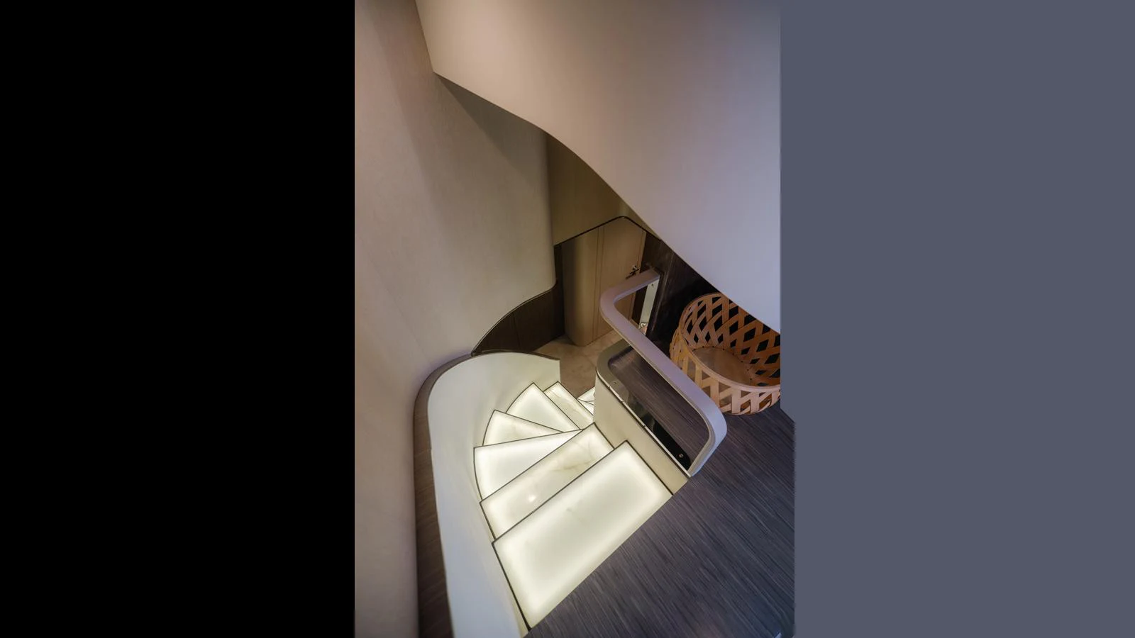 A modern, illuminated staircase with sleek design elements. aboard 98.92' AZIMUT GRANDE Yacht for Sale