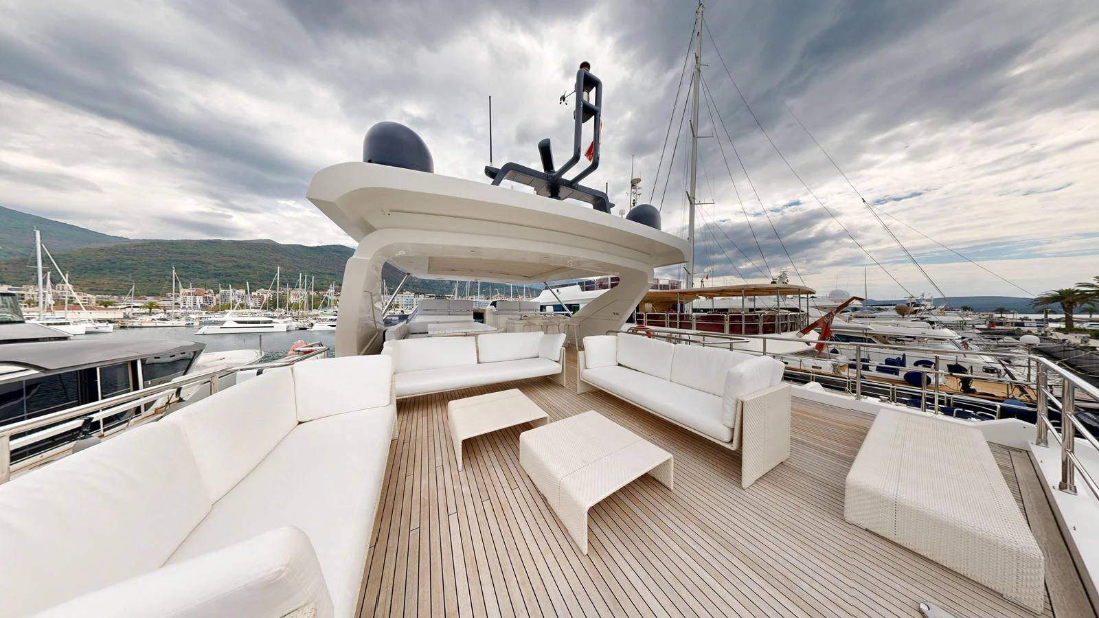 The flybridge offers a spacious and stylish outdoor lounging area with ample seating and modern design. aboard 98.92' AZIMUT GRANDE Yacht for Sale