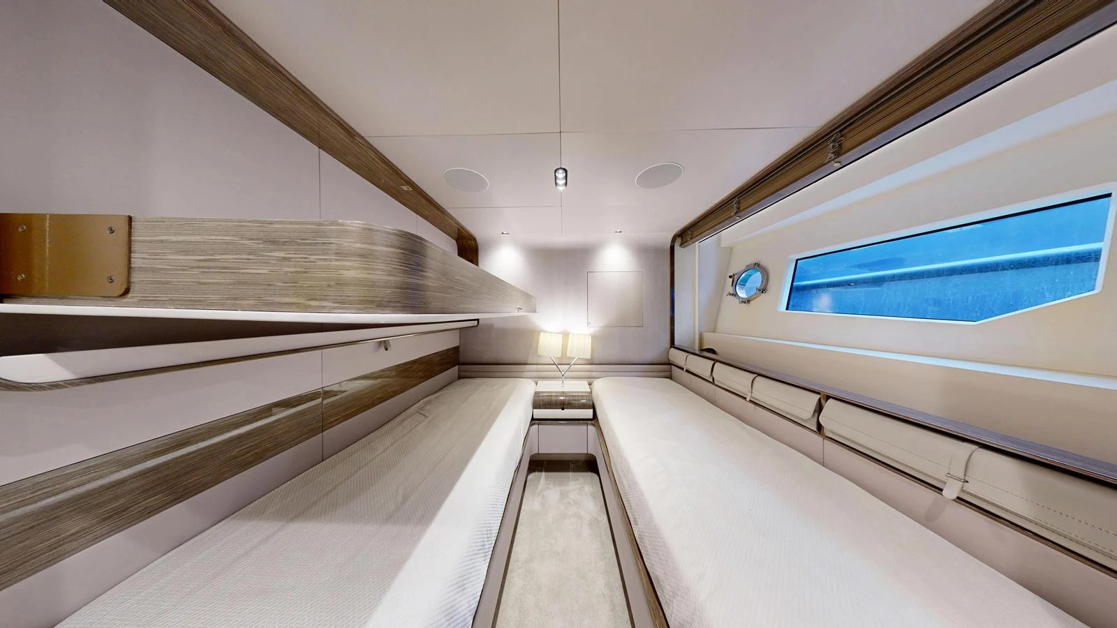 The guest cabin features twin beds and modern lighting, offering a comfortable and stylish retreat. aboard 98.92' AZIMUT GRANDE Yacht for Sale