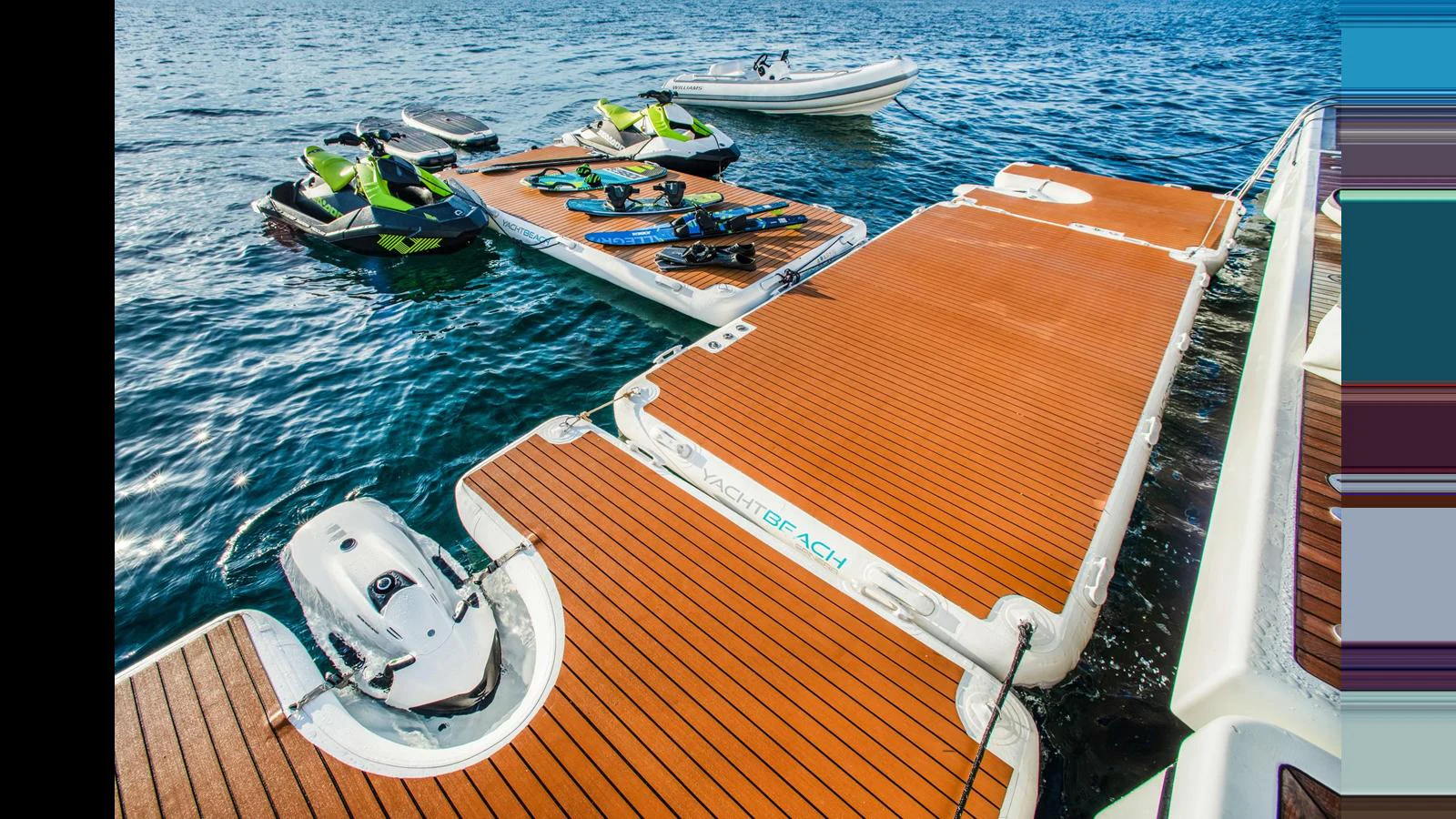 The yacht features a spacious floating dock with water toys and a tender, perfect for aquatic adventures. aboard MIDORI Yacht for Sale