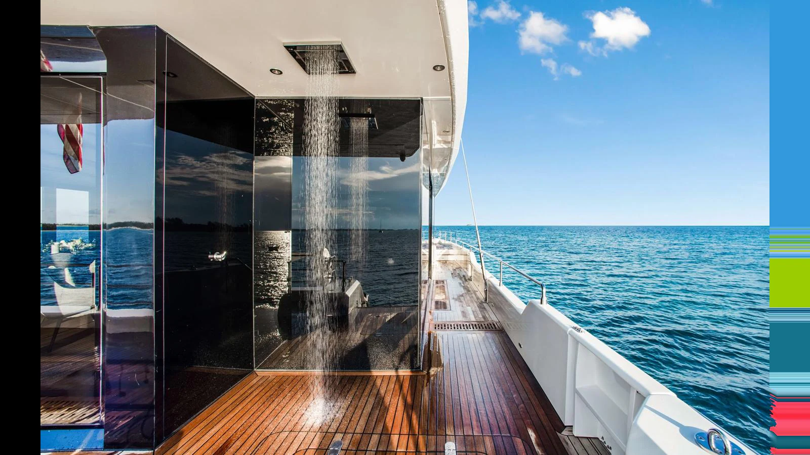 The yacht's aft deck features a luxurious outdoor shower with stunning ocean views. aboard MIDORI Yacht for Sale