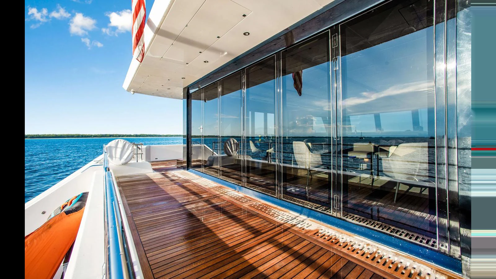The aft deck offers a spacious and inviting area with stunning ocean views and comfortable seating. aboard MIDORI Yacht for Sale