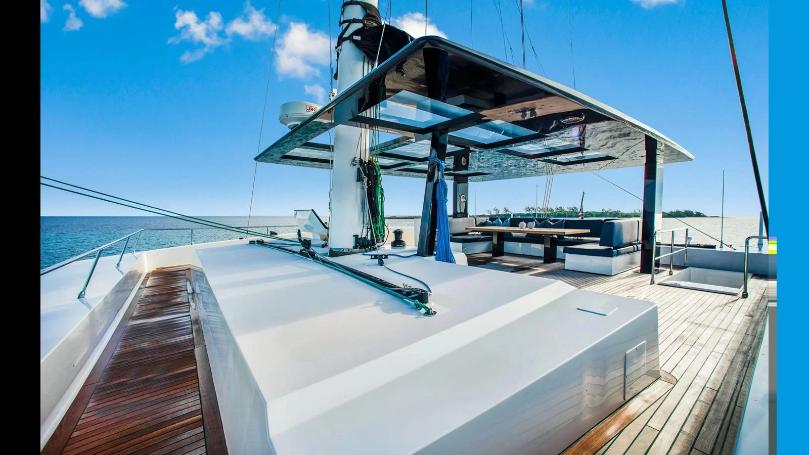 The flybridge offers a spacious and luxurious outdoor area with ample seating and stunning ocean views. aboard MIDORI Yacht for Sale