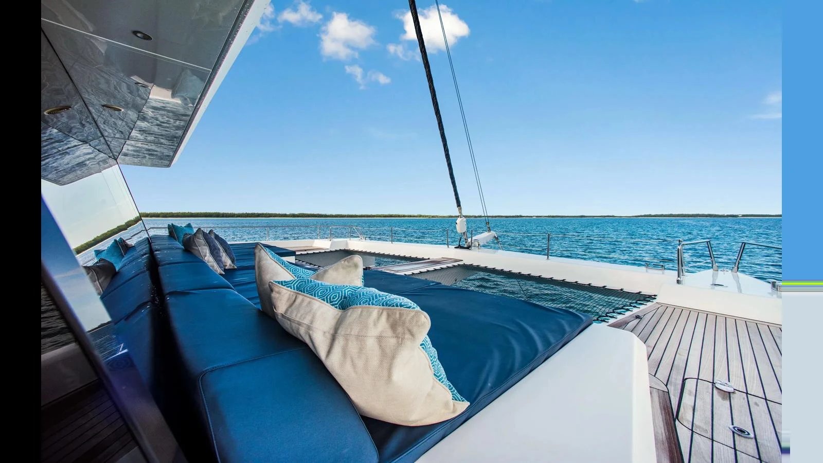 The sundeck offers a luxurious lounging area with plush cushions and stunning ocean views. aboard MIDORI Yacht for Sale