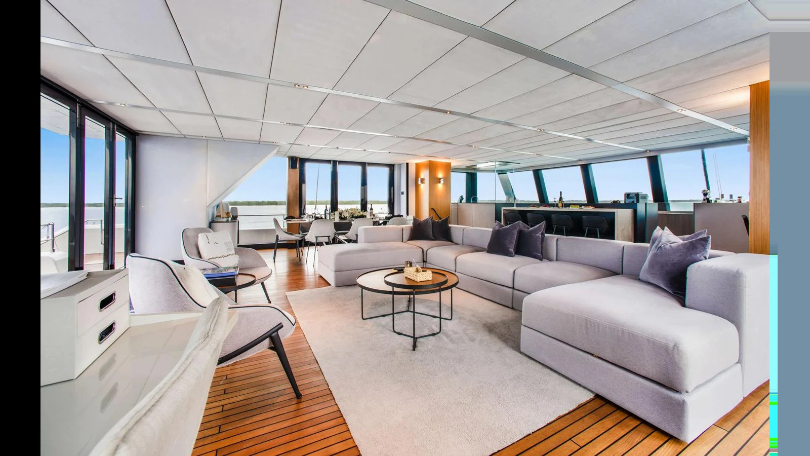 The spacious salon features modern furnishings and ample natural light. aboard MIDORI Yacht for Sale