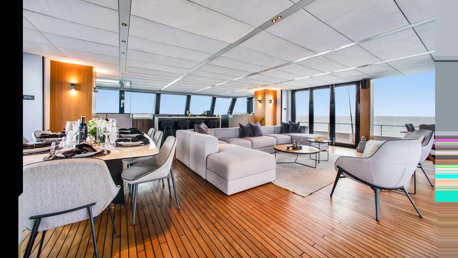 The spacious salon features modern furnishings and ample natural light, creating a luxurious and comfortable atmosphere. aboard MIDORI Yacht for Sale