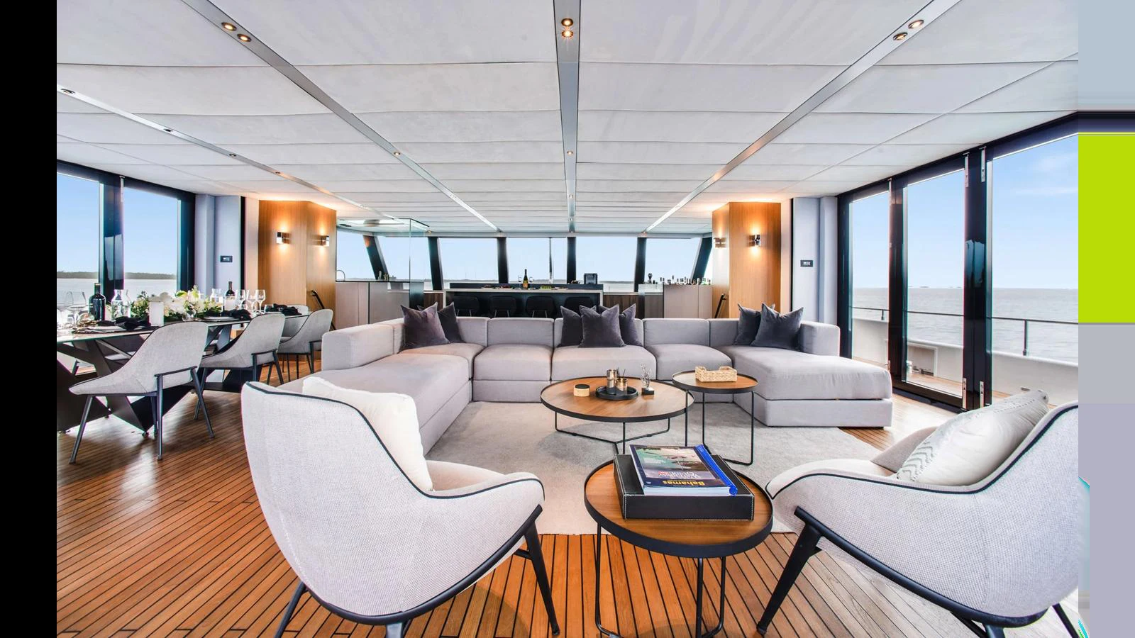 The spacious salon features modern furnishings and panoramic windows offering stunning sea views. aboard MIDORI Yacht for Sale