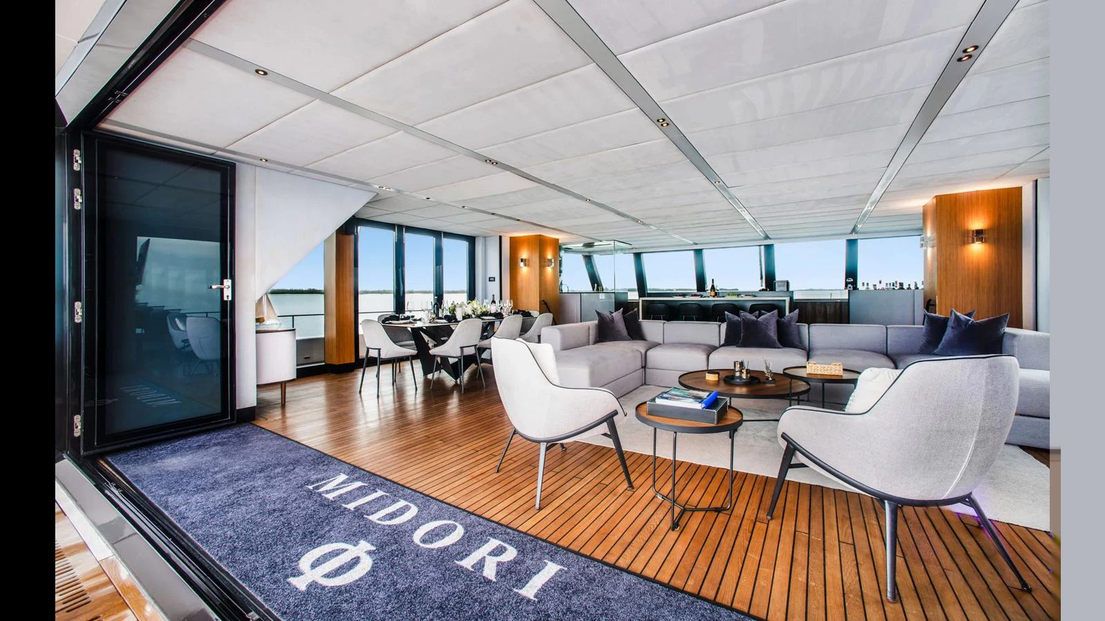 The spacious salon features modern furnishings and ample natural light. aboard MIDORI Yacht for Sale