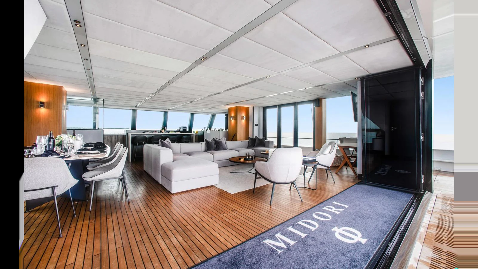 The spacious salon features modern furnishings and ample natural light. aboard MIDORI Yacht for Sale