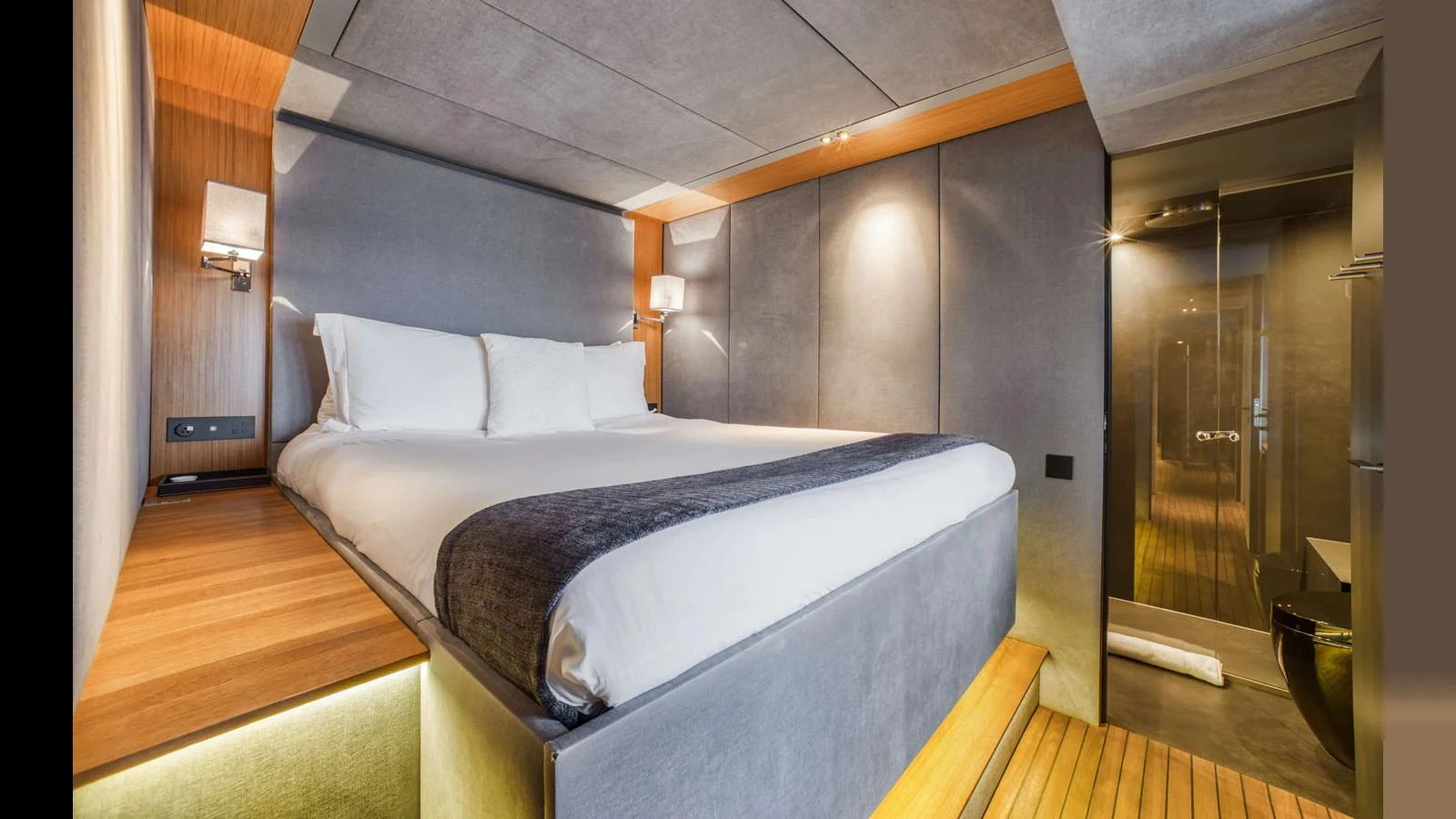A luxurious stateroom featuring a plush bed and modern design elements. aboard MIDORI Yacht for Sale