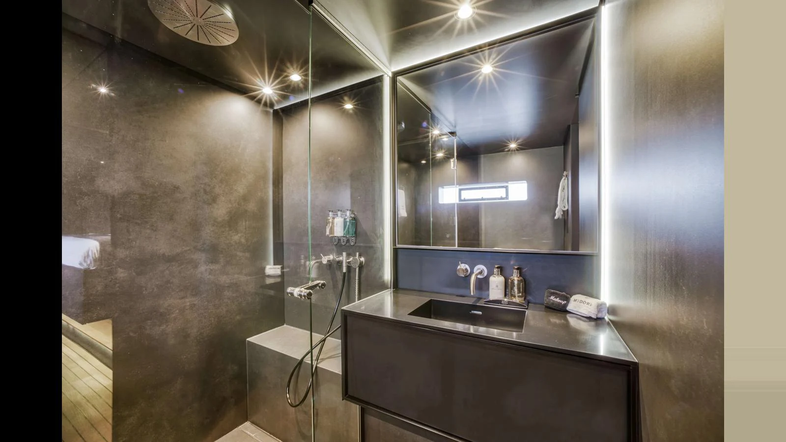 The yacht's bathroom features modern fixtures and a sleek design. aboard MIDORI Yacht for Sale