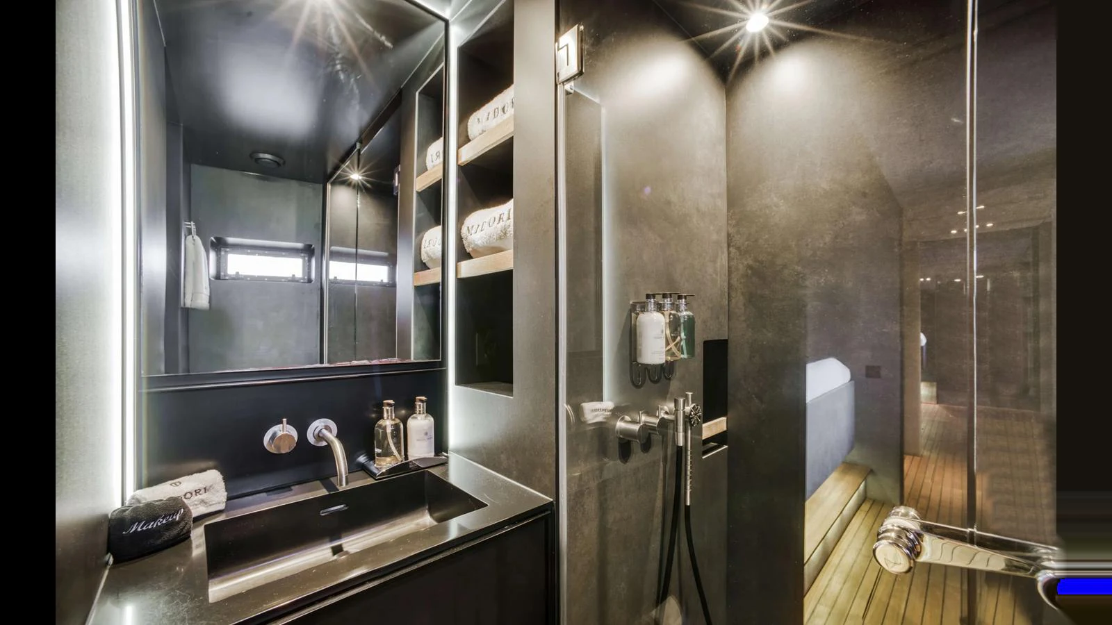 The yacht's bathroom features modern fixtures and elegant lighting. aboard MIDORI Yacht for Sale