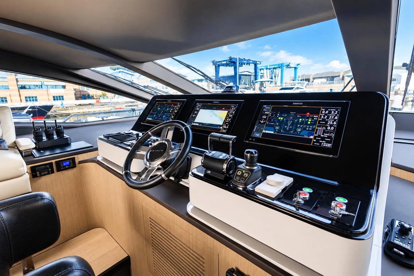 The helm station features advanced navigation equipment and luxurious seating, offering a commanding view for the captain. aboard ESCAPE Yacht for Sale
