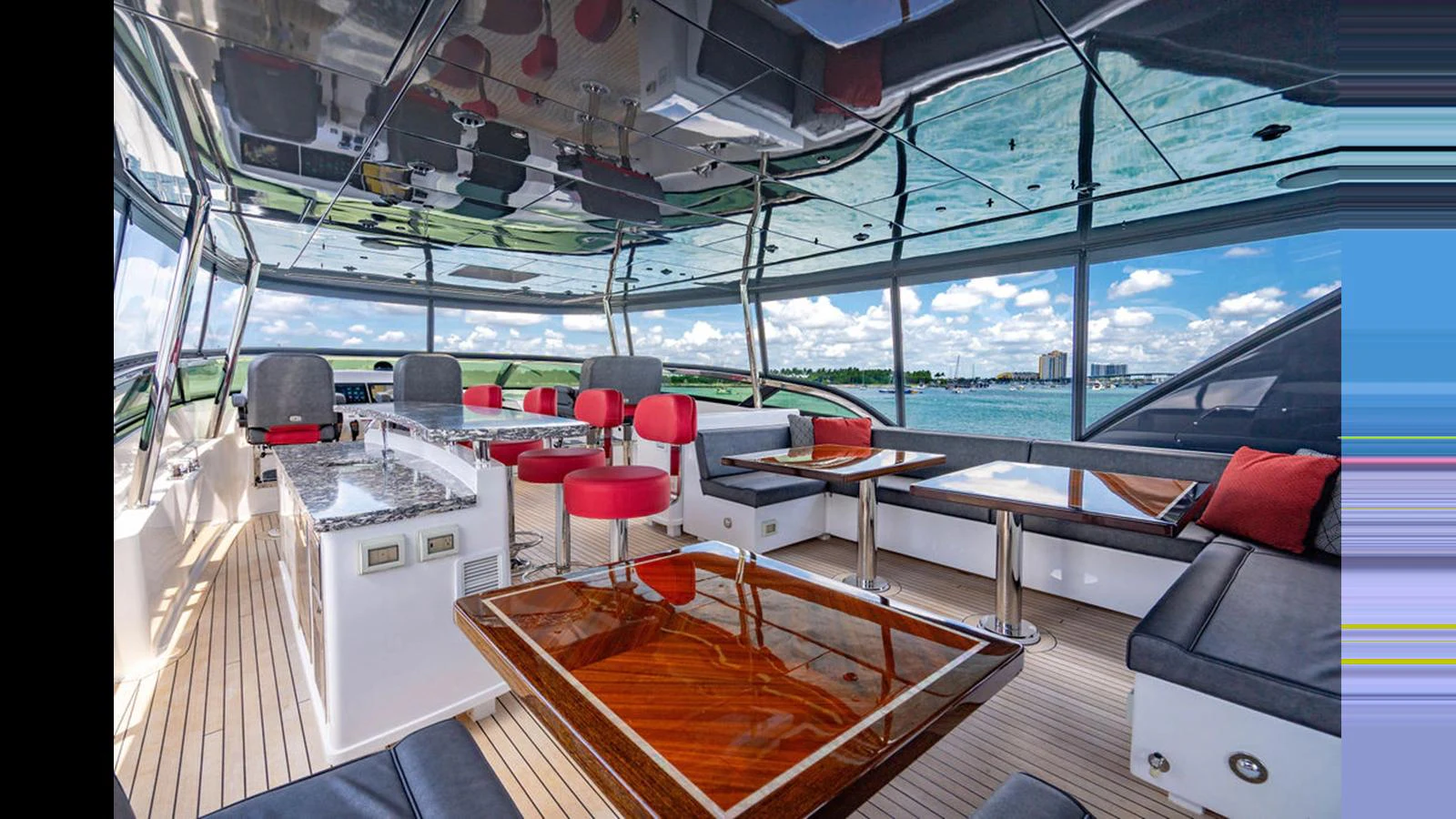 The flybridge offers a spacious and luxurious area with ample seating and stunning views. aboard TRU LUV Yacht for Sale