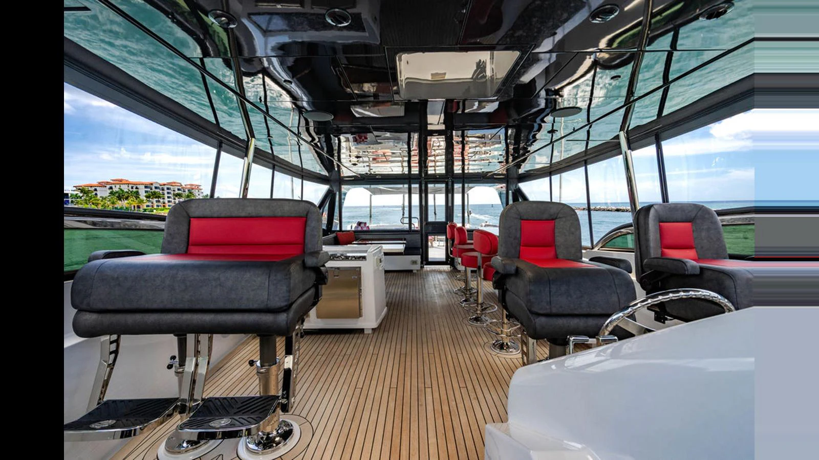 The yacht's salon features modern seating with panoramic views and luxurious finishes. aboard TRU LUV Yacht for Sale