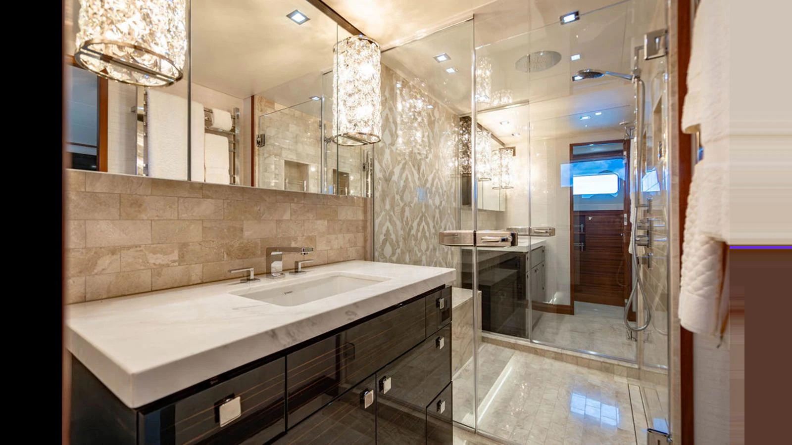 The yacht's bathroom features a luxurious design with modern fixtures and elegant lighting. aboard TRU LUV Yacht for Sale